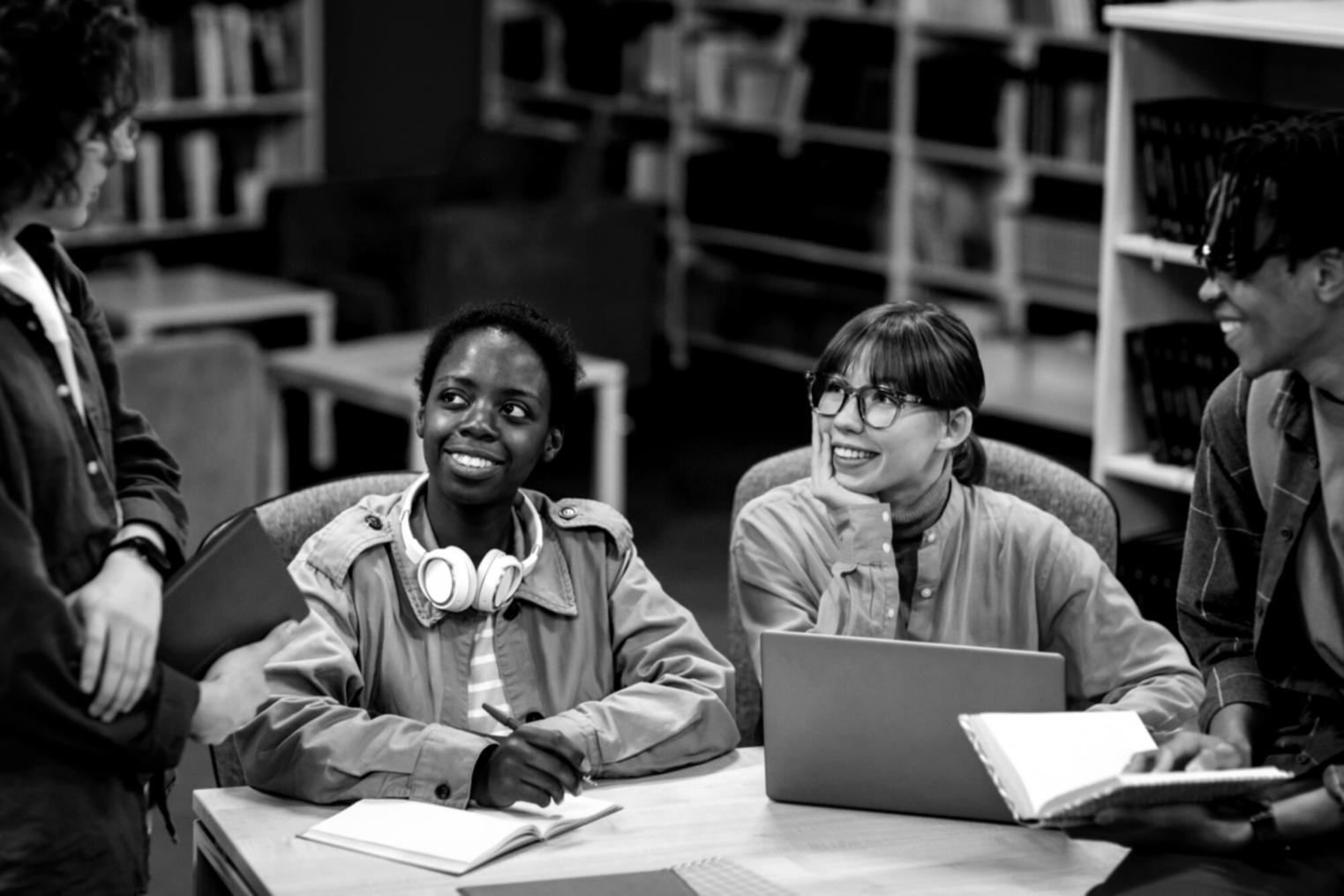 Students collaborating on financial planning exercises in a modern learning environment