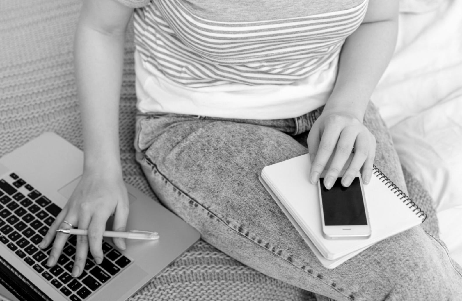 Financial planning workspace showing budget documents and strategic planning materials